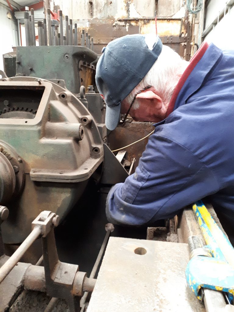 Jim Hanmer removing a bolt holding Fluff's engine