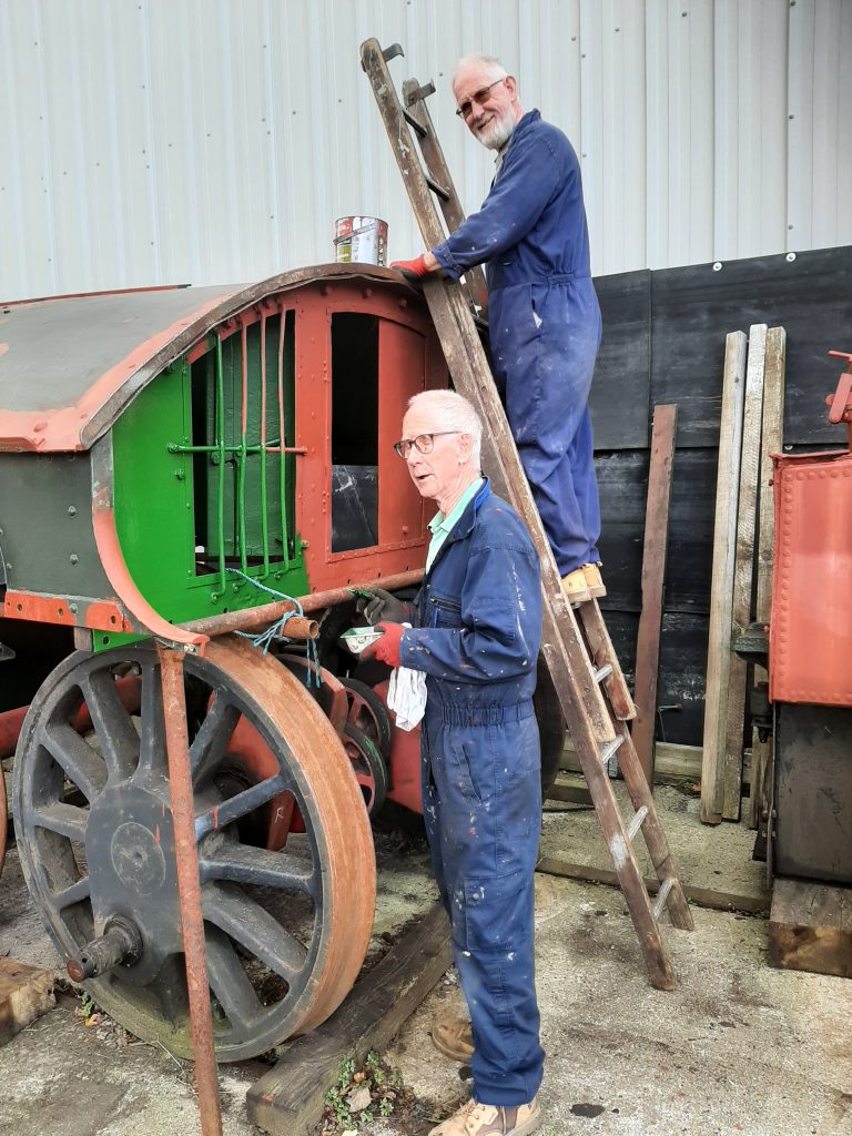 Jon and Sim painting 5643's cab roof