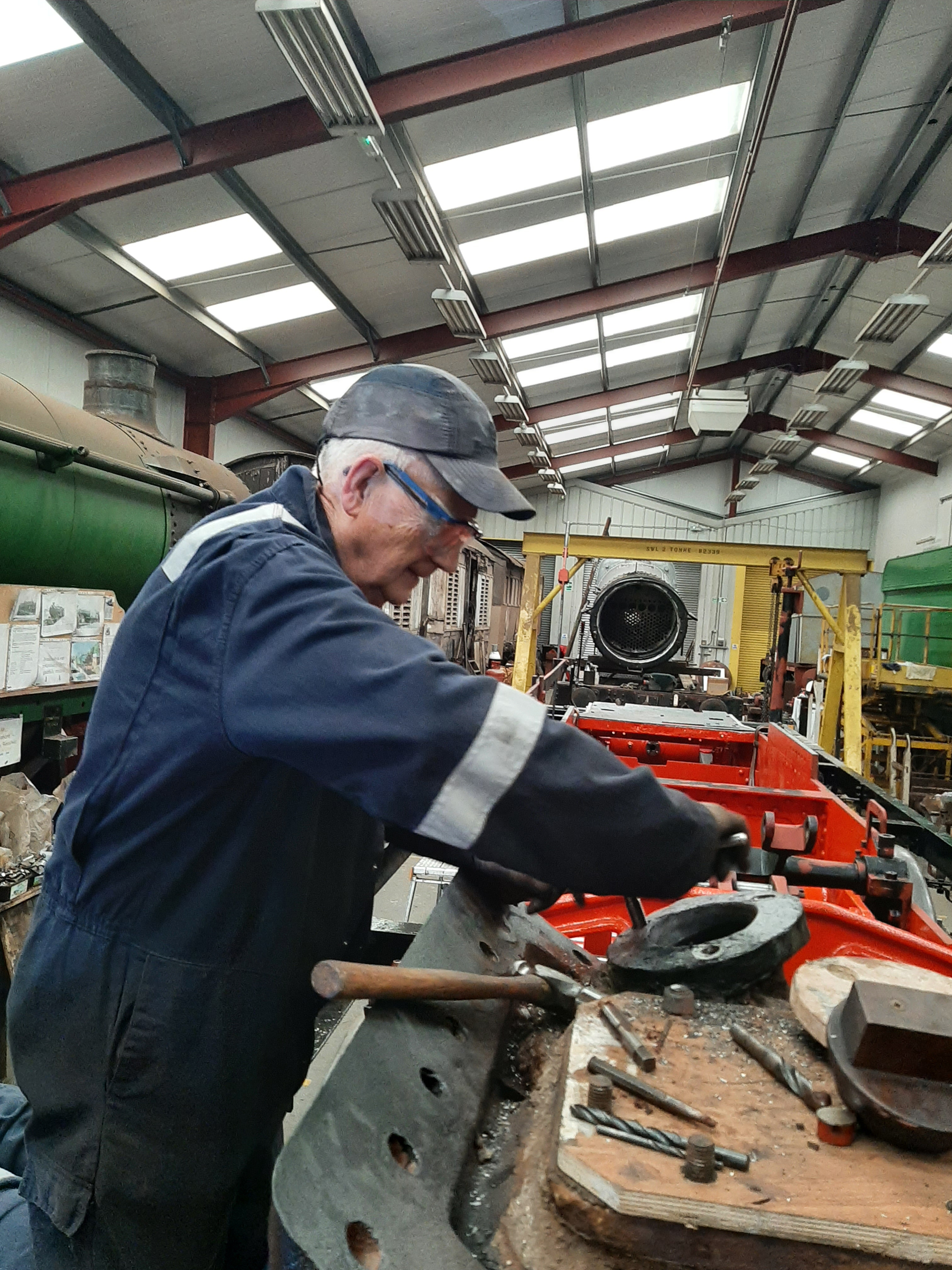 Ron Crowe tapping out the main steam pipe flanges on 5643