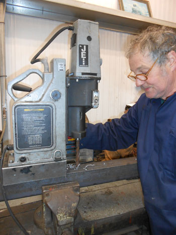 Keith drills a new piece of angle for the front tender drag box