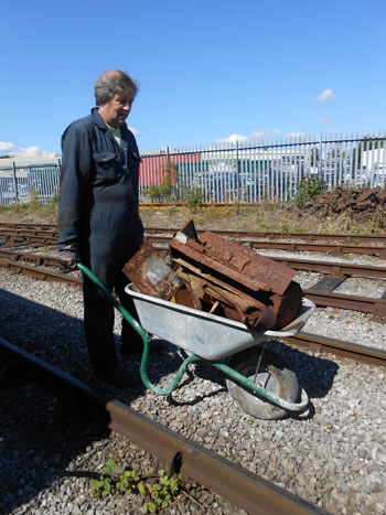 Mike with a barrow-load of rusty old toolboxes